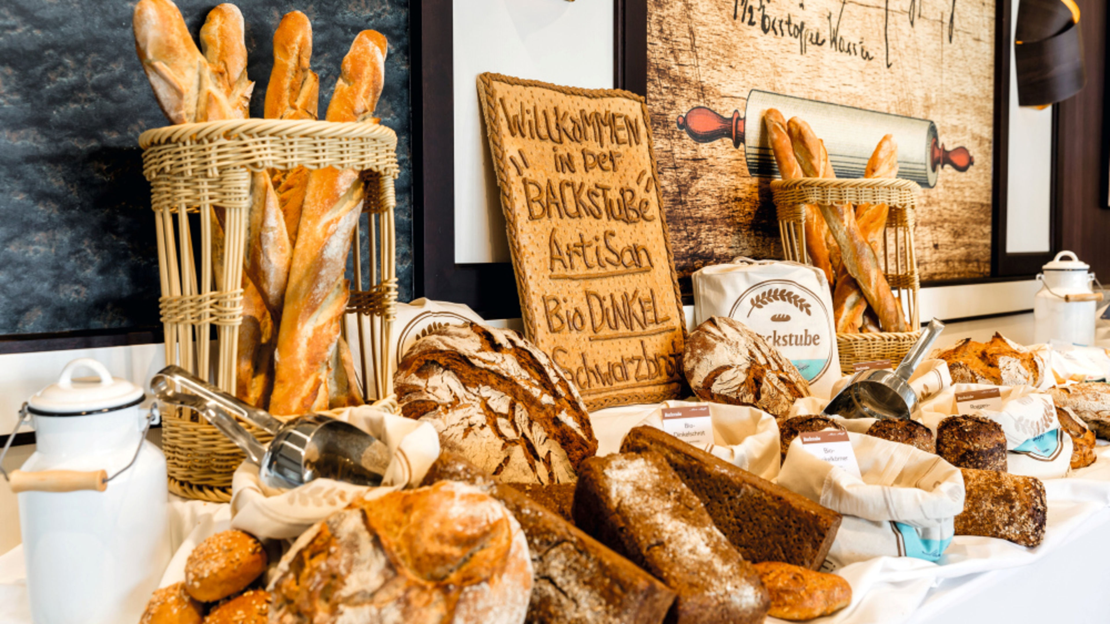 Selection of breads in the Backstube – Bakery Corner – artisan bread including baguettes, organic spelt bread and brown bread Selection of breads in the Backstube – Bakery Corner – artisan bread including baguettes, organic spelt bread and brown bread