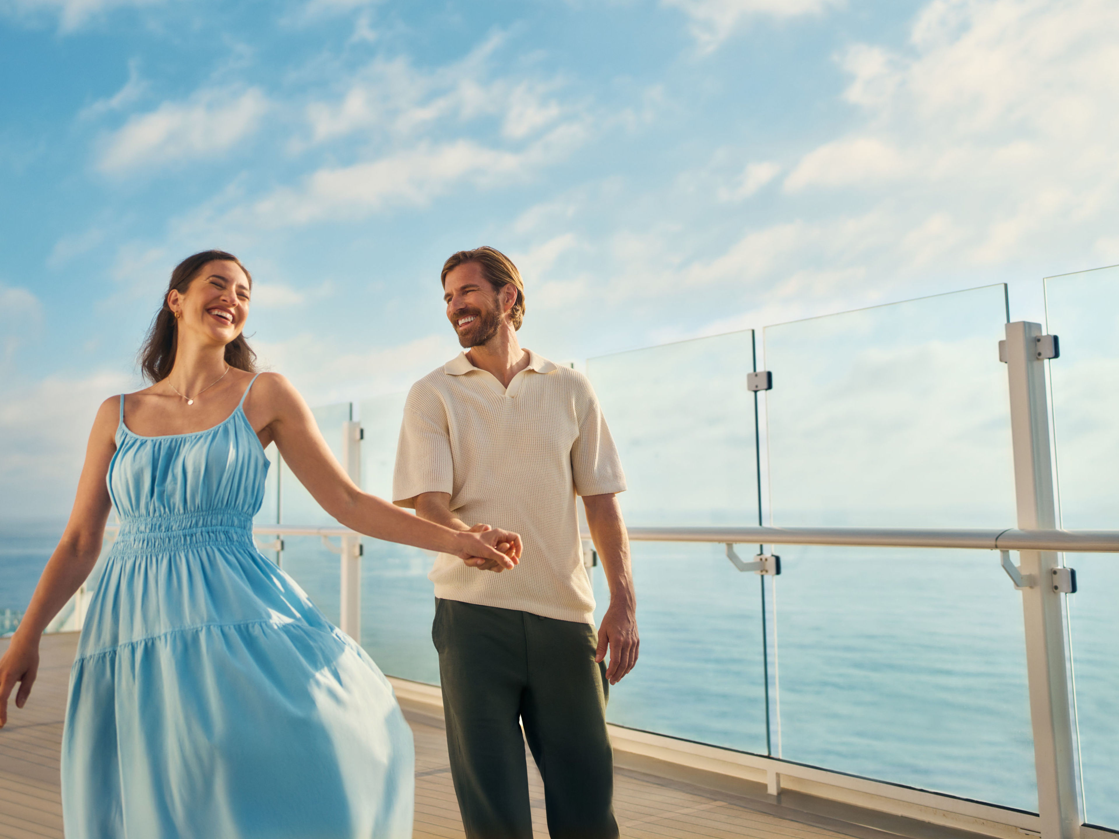 Couple walking on cruise ship of the Mein Schiff® fleet, blue sky. Couple walking on cruise ship of the Mein Schiff® fleet, blue sky.