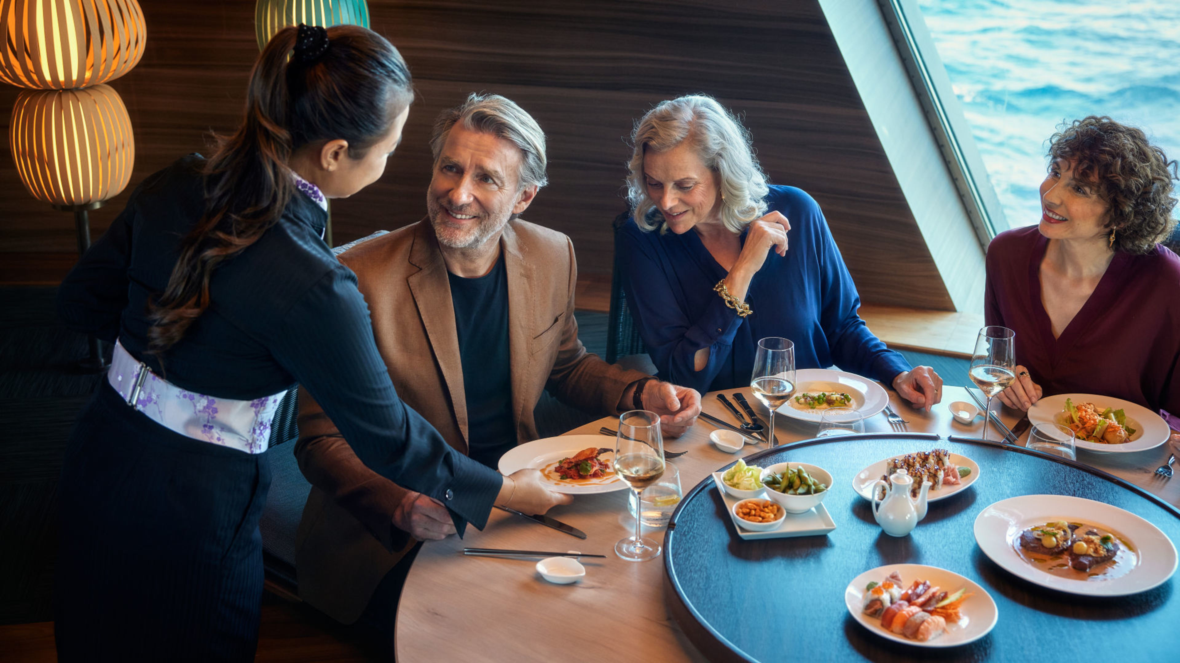 People are dining in an elegant restaurant on a cruise ship of the Mein Schiff® fleet. People are dining in an elegant restaurant on a cruise ship of the Mein Schiff® fleet.