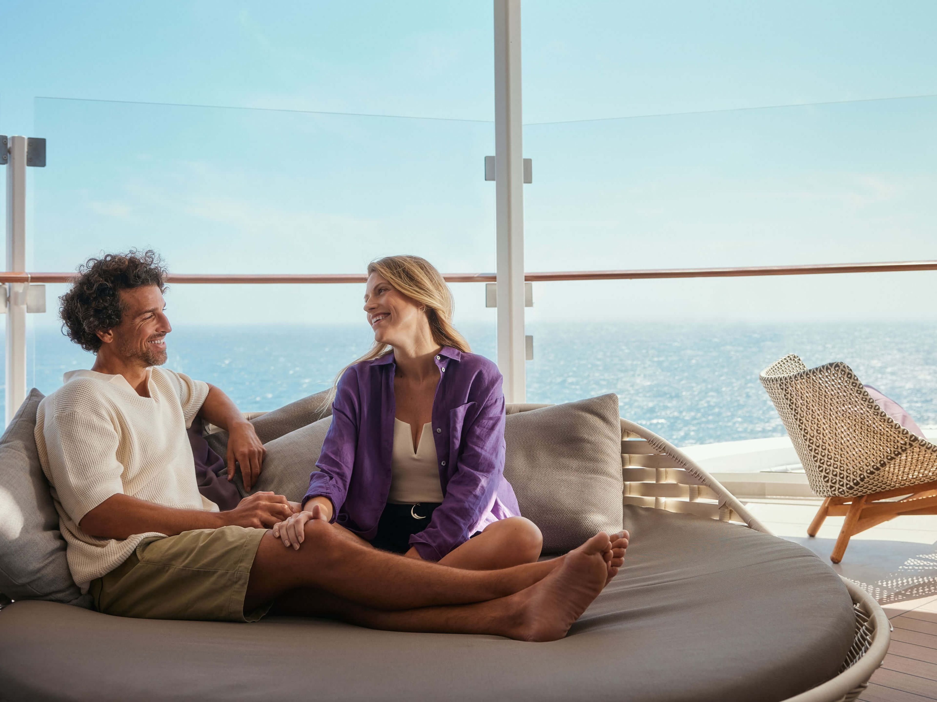 Couple relaxing on cruise ship of the Mein Schiff® fleet, sea view. Couple relaxing on cruise ship of the Mein Schiff® fleet, sea view.